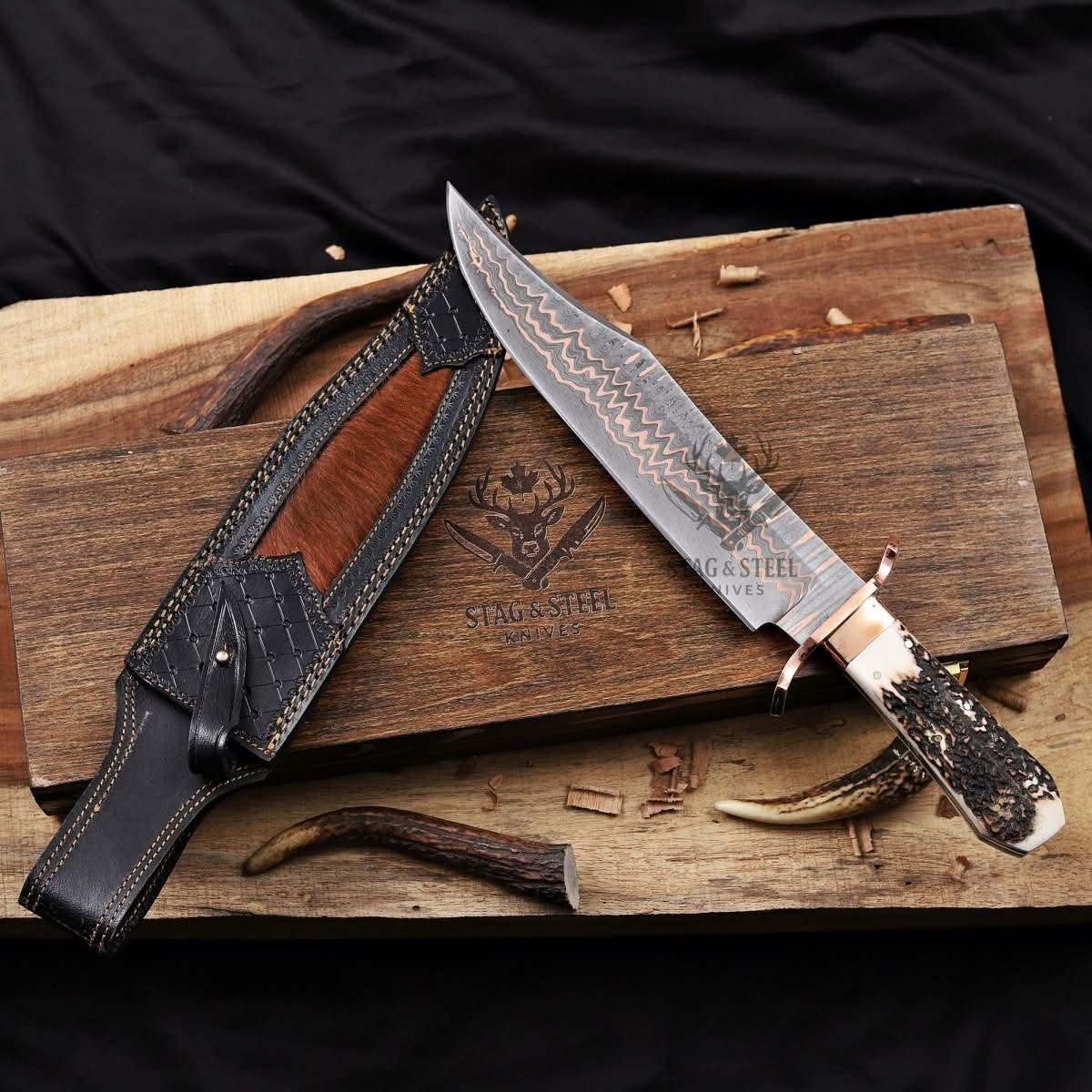 Copper Damascus bowie knife with layered pattern blade, full tang construction, and fitted handle